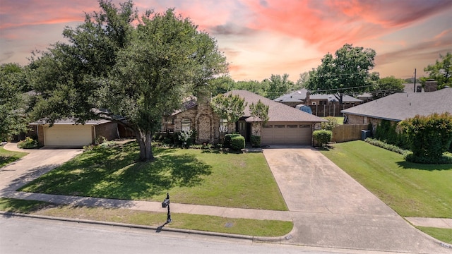 view of front of home featuring concrete driveway and a garage