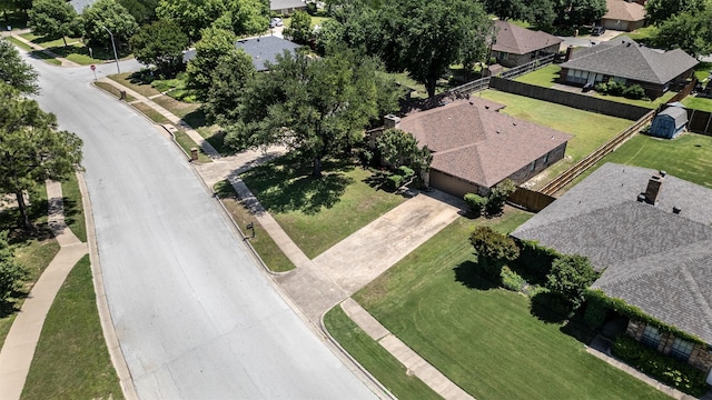 aerial view of property and surrounding area featuring nearby suburban area