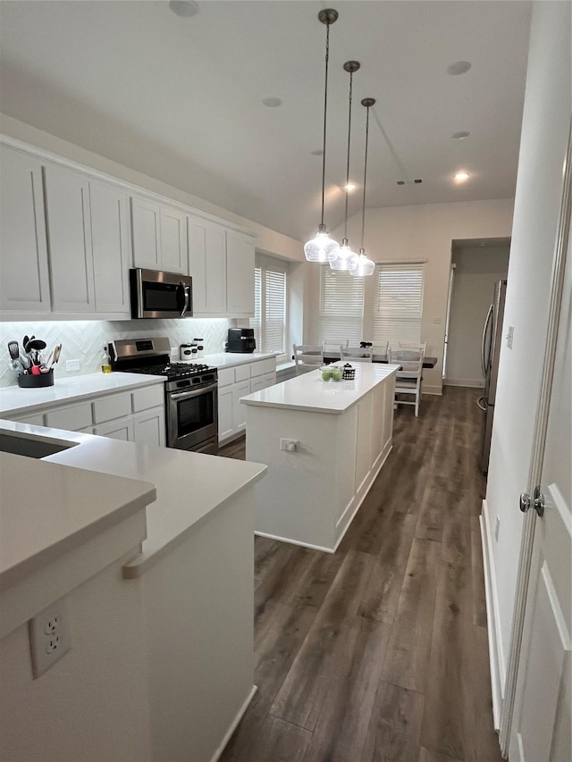 1812 Horseshoe Ln, Van Alstyne, TX 75495 - kitchen with stainless steel appliances, a center island, tasteful backsplash, light countertops, and white cabinetry