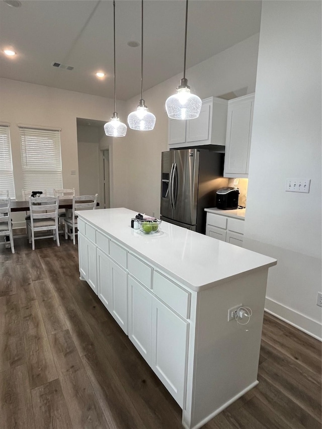 1812 Horseshoe Ln, Van Alstyne, TX 75495 - kitchen featuring stainless steel fridge with ice dispenser, dark wood finished floors, white cabinetry, and recessed lighting
