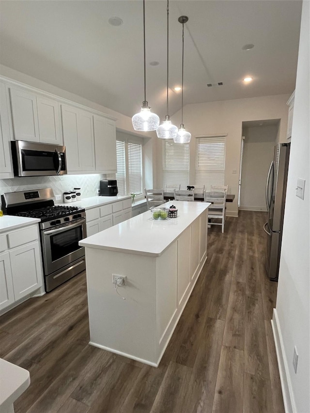 1812 Horseshoe Ln, Van Alstyne, TX 75495 - kitchen featuring stainless steel appliances, a center island, white cabinetry, dark wood-style floors, and recessed lighting