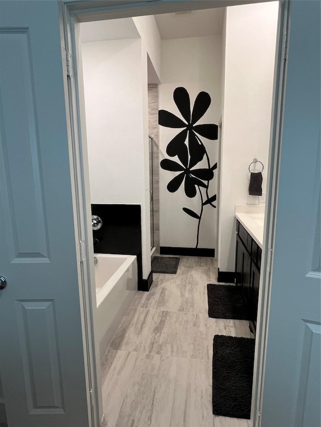 1812 Horseshoe Ln, Van Alstyne, TX 75495 - full bathroom with vanity, a stall shower, and a bath
