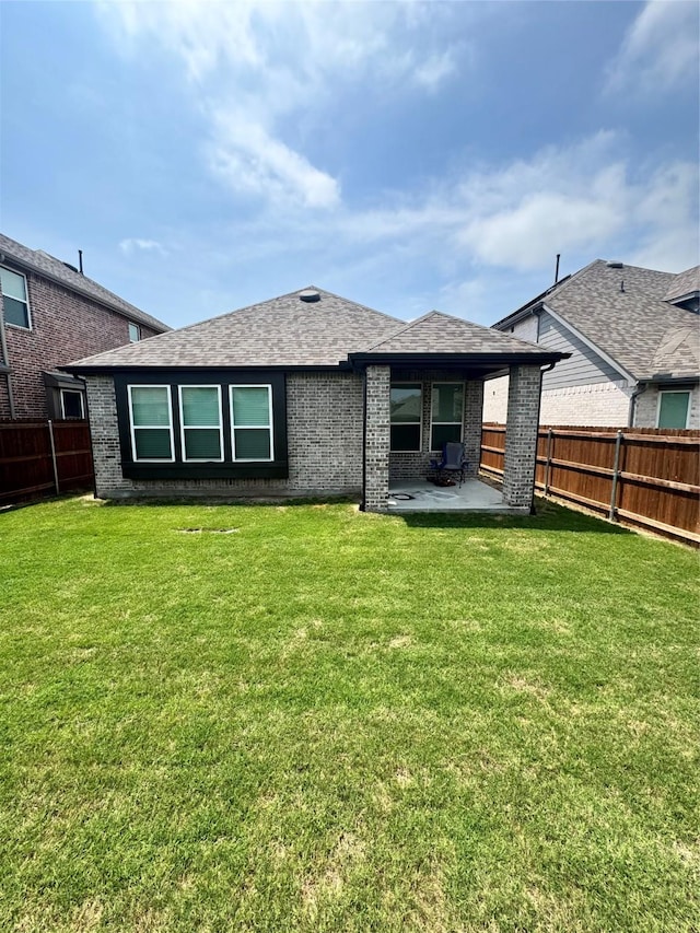 1812 Horseshoe Ln, Van Alstyne, TX 75495 - rear view of property featuring a patio, brick siding, and roof with shingles