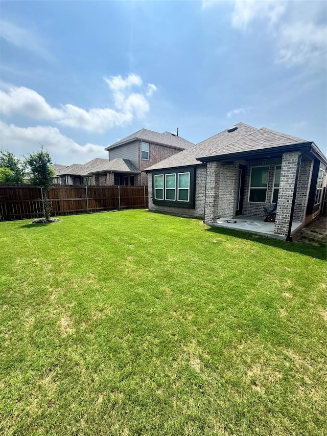 1812 Horseshoe Ln, Van Alstyne, TX 75495 - back of property with a patio area and brick siding