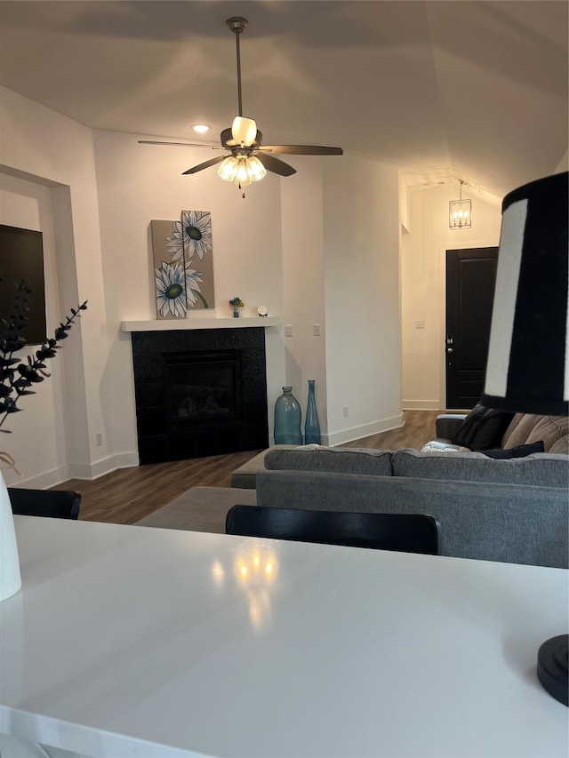 1812 Horseshoe Ln, Van Alstyne, TX 75495 - living area with a tile fireplace, wood finished floors, baseboards, and a ceiling fan