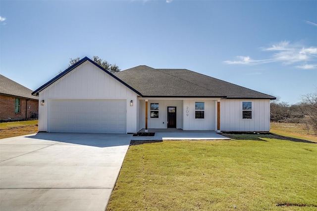 209 Lanai Dr, Runaway Bay, TX 76426 - modern inspired farmhouse with a garage, concrete driveway, a front yard, board and batten siding, and a shingled roof