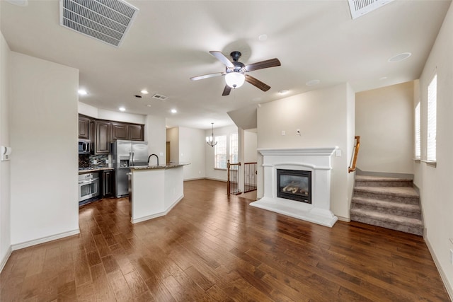 7941 Parkwood Blvd, Plano, TX 75024 - unfurnished living room featuring ceiling fan, dark wood-type flooring, baseboards, and recessed lighting