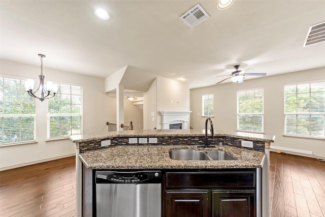 7941 Parkwood Blvd, Plano, TX 75024 - kitchen featuring dishwasher, a sink, ceiling fan, dark wood-type flooring, and a center island with sink