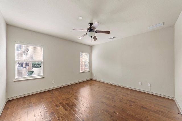 7941 Parkwood Blvd, Plano, TX 75024 - unfurnished room featuring plenty of natural light, wood finished floors, a ceiling fan, and baseboards