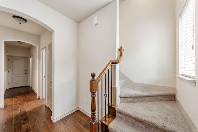 7941 Parkwood Blvd, Plano, TX 75024 - stairs featuring arched walkways, hardwood / wood-style flooring, and baseboards