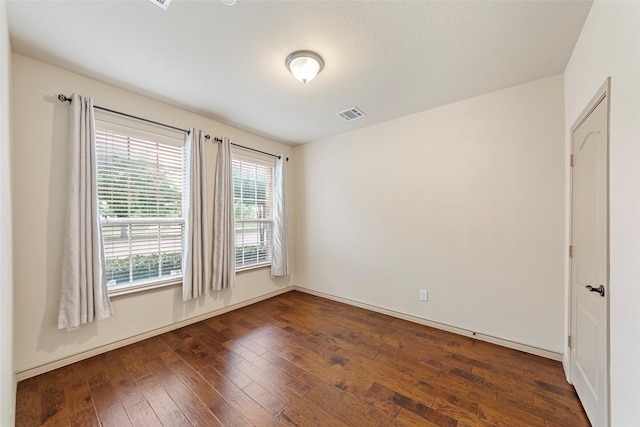 7941 Parkwood Blvd, Plano, TX 75024 - unfurnished room with dark wood-type flooring and baseboards