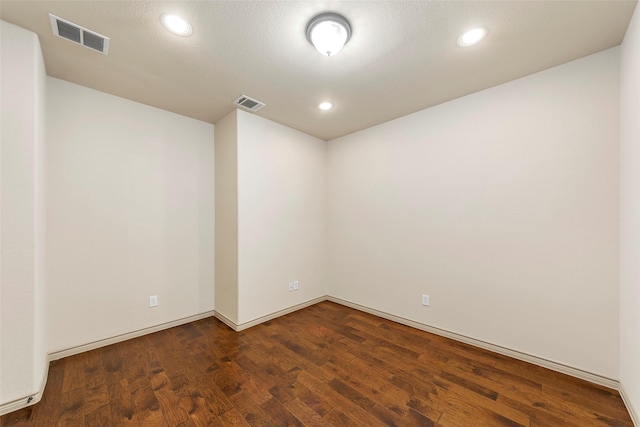 7941 Parkwood Blvd, Plano, TX 75024 - spare room featuring dark wood-type flooring, recessed lighting, and baseboards
