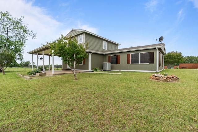 560 N Cardinal Rd, Reno, TX 76020 - back of house featuring a patio area, cooling unit, and a lawn