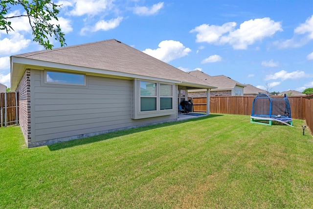 716 Newberry Ln, Royse City, TX 75189 - rear view of house with a trampoline