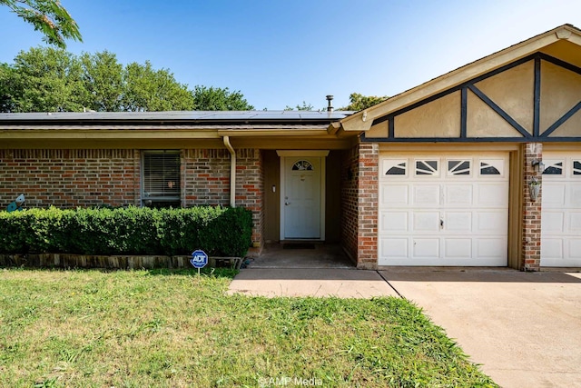 3226 Whitewing Way, Abilene, TX 79606 - ranch-style house with roof mounted solar panels, brick siding, an attached garage, and driveway