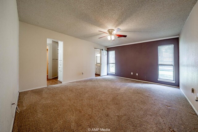 3226 Whitewing Way, Abilene, TX 79606 - empty room featuring ceiling fan, carpet flooring, baseboards, and a textured ceiling