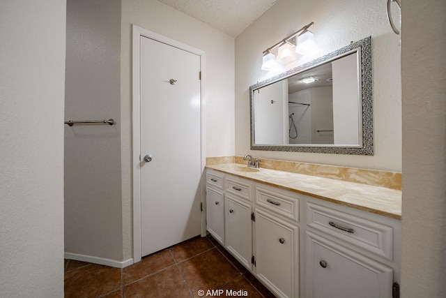 3226 Whitewing Way, Abilene, TX 79606 - bathroom with vanity, tile patterned flooring, and a shower