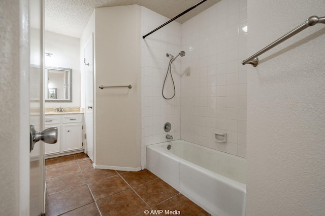 3226 Whitewing Way, Abilene, TX 79606 - bathroom with vanity, tile patterned flooring, bathing tub / shower combination, a textured ceiling, and baseboards