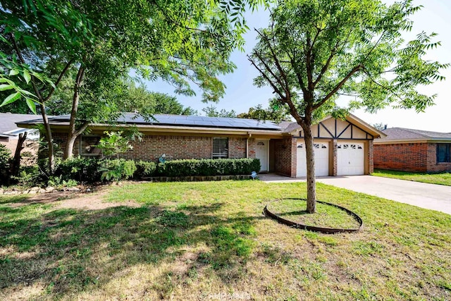 3226 Whitewing Way, Abilene, TX 79606 - single story home with an attached garage, solar panels, a front lawn, and driveway