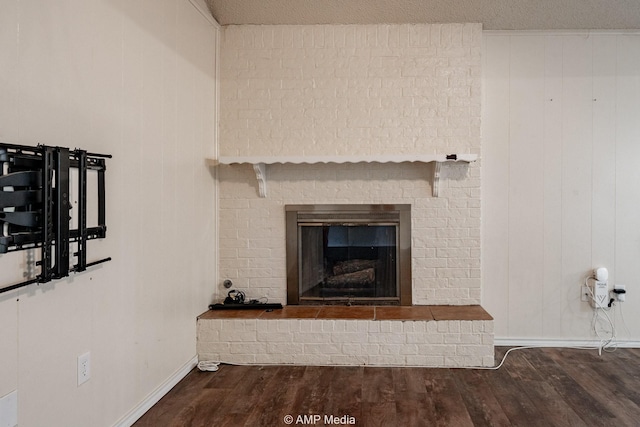 3226 Whitewing Way, Abilene, TX 79606 - detailed view of wood finished floors, baseboards, and a fireplace