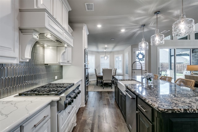 1801 Wichita Dr, Prosper, TX 75078 - kitchen featuring a sink, appliances with stainless steel finishes, dark wood finished floors, white cabinetry, and recessed lighting