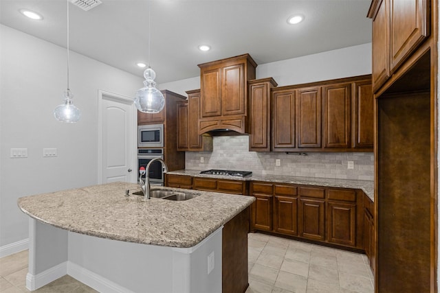 14824 Belclaire Ave, Aledo, TX 76008 - kitchen with a sink, appliances with stainless steel finishes, backsplash, light stone countertops, and recessed lighting