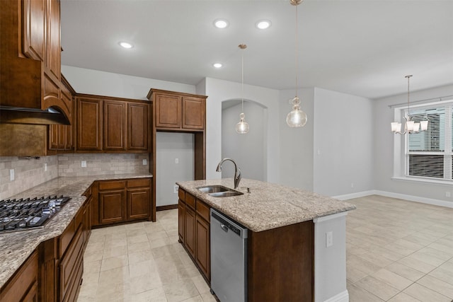 14824 Belclaire Ave, Aledo, TX 76008 - kitchen with a sink, stainless steel appliances, tasteful backsplash, light stone counters, and an island with sink