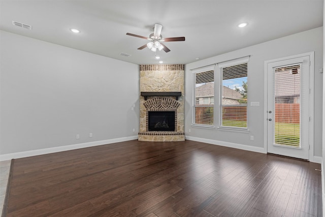 14824 Belclaire Ave, Aledo, TX 76008 - unfurnished living room with a ceiling fan, wood finished floors, a stone fireplace, baseboards, and recessed lighting