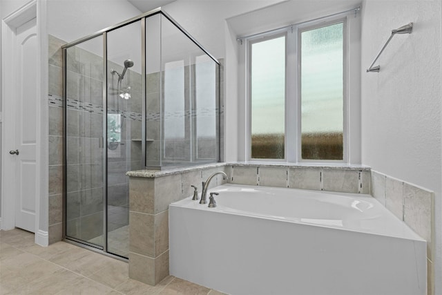 14824 Belclaire Ave, Aledo, TX 76008 - bathroom featuring a shower stall, a bath, and tile patterned floors