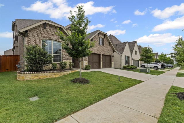 14824 Belclaire Ave, Aledo, TX 76008 - french country inspired facade with brick siding, driveway, roof with shingles, and an attached garage