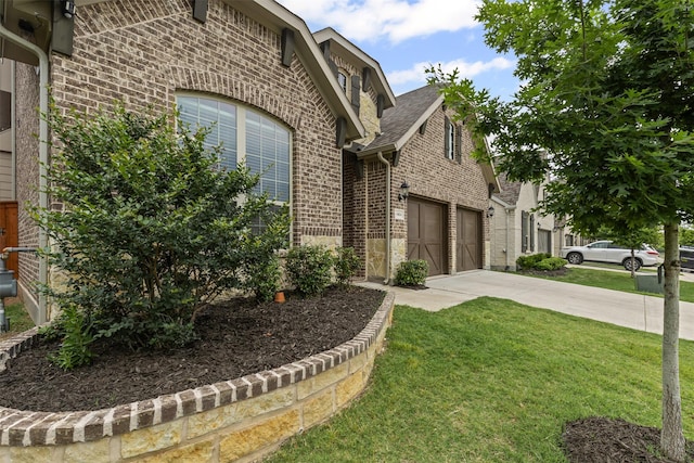 14824 Belclaire Ave, Aledo, TX 76008 - view of front of home with brick siding, concrete driveway, a front yard, an attached garage, and a shingled roof