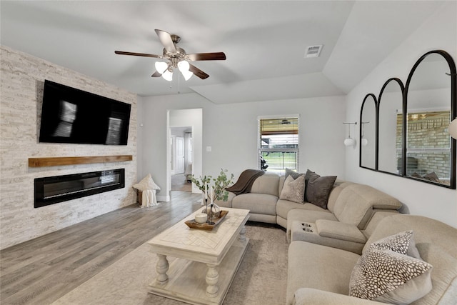 3708 Bennett Trl, Celina, TX 75009 - living area featuring wood finished floors, a ceiling fan, and a fireplace