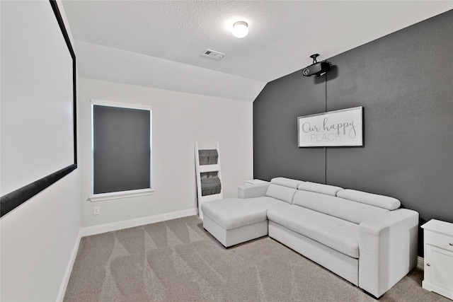 3708 Bennett Trl, Celina, TX 75009 - carpeted living room with lofted ceiling, baseboards, and a textured ceiling