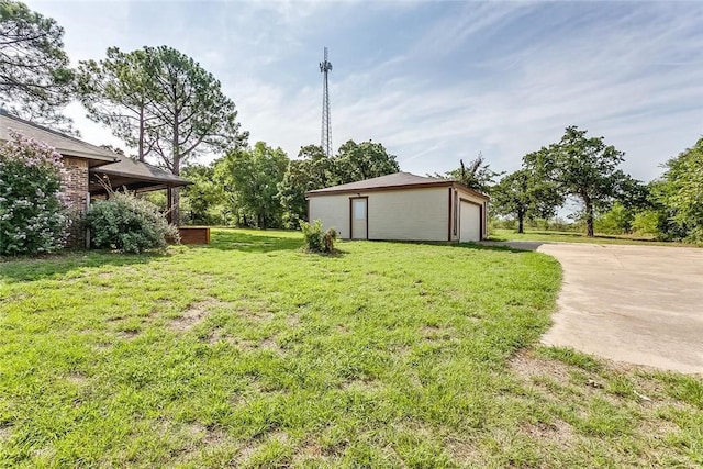 1200 County Road 701a, Cleburne, TX 76031 - view of grassy yard featuring concrete driveway and an outdoor structure
