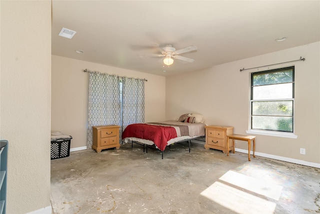 1200 County Road 701a, Cleburne, TX 76031 - bedroom featuring unfinished concrete flooring, a ceiling fan, and baseboards