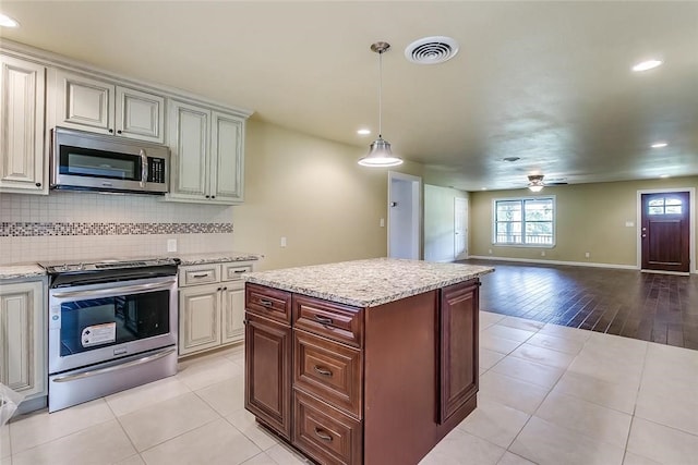 1200 County Road 701a, Cleburne, TX 76031 - kitchen with stainless steel appliances, recessed lighting, a ceiling fan, decorative backsplash, and open floor plan