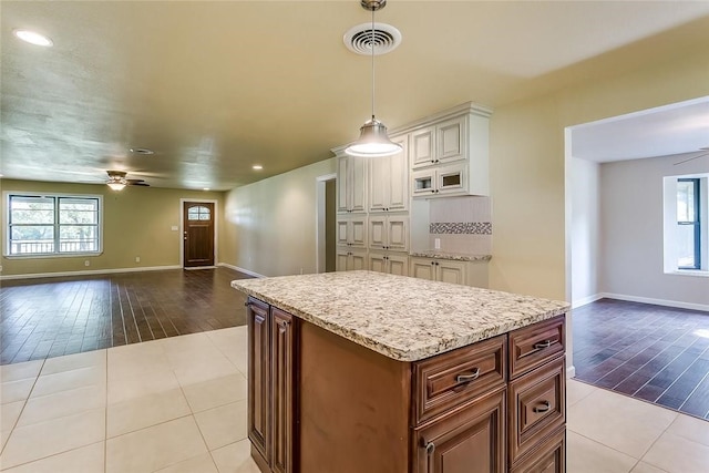 1200 County Road 701a, Cleburne, TX 76031 - kitchen with open floor plan, ceiling fan, decorative light fixtures, baseboards, and recessed lighting