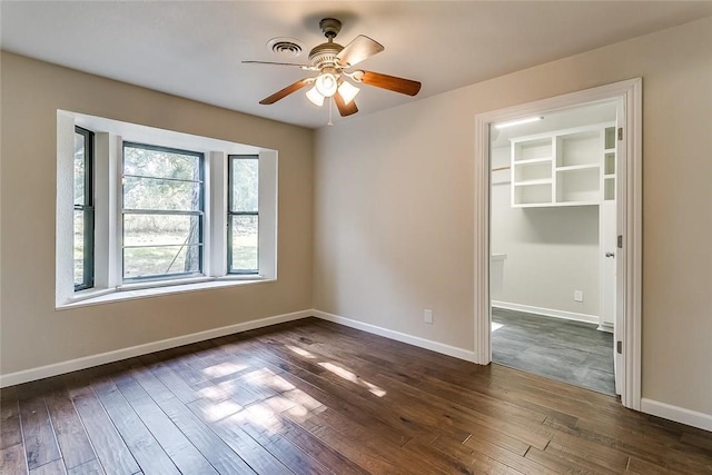 1200 County Road 701a, Cleburne, TX 76031 - unfurnished room featuring dark wood-style floors, ceiling fan, and baseboards