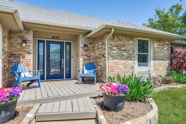 1835 Hatherly Dr, Plano, TX 75023 - entrance to property with roof with shingles, brick siding, and stone siding