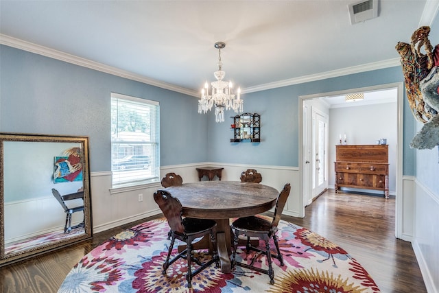 1835 Hatherly Dr, Plano, TX 75023 - dining area featuring ornamental molding, wood finished floors, a chandelier, and a wainscoted wall