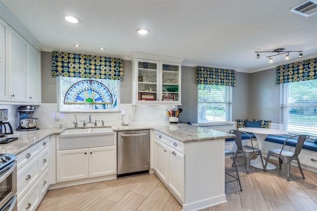 1835 Hatherly Dr, Plano, TX 75023 - kitchen with stainless steel appliances, a sink, a peninsula, white cabinets, and crown molding
