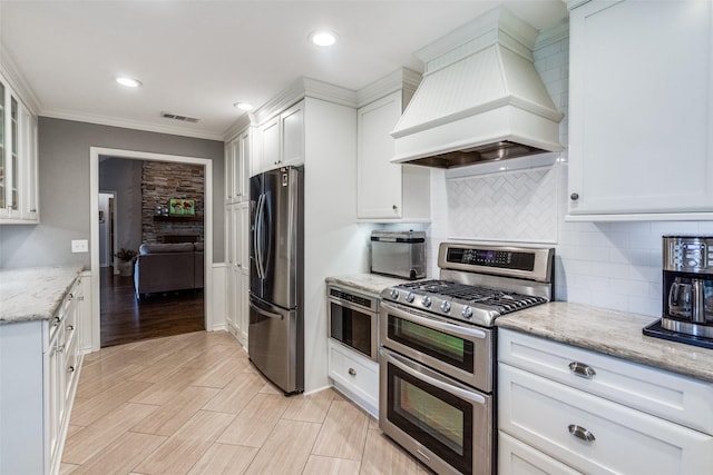 1835 Hatherly Dr, Plano, TX 75023 - kitchen featuring stainless steel appliances, custom range hood, white cabinets, glass insert cabinets, and decorative backsplash