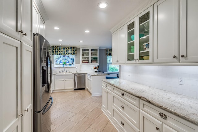 1835 Hatherly Dr, Plano, TX 75023 - kitchen featuring stainless steel appliances, decorative backsplash, recessed lighting, a sink, and white cabinetry