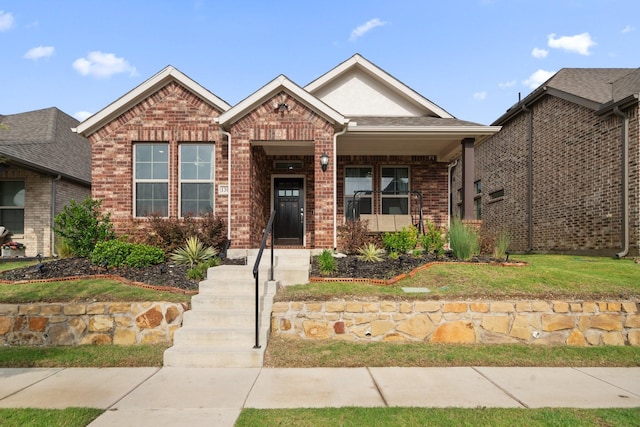 1309 Haybale Ln, Garland, TX 75042 - view of front of home with brick siding and a front lawn