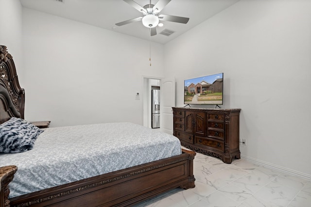 1309 Haybale Ln, Garland, TX 75042 - bedroom with light marble finish floors, stainless steel fridge with ice dispenser, a ceiling fan, baseboards, and a towering ceiling