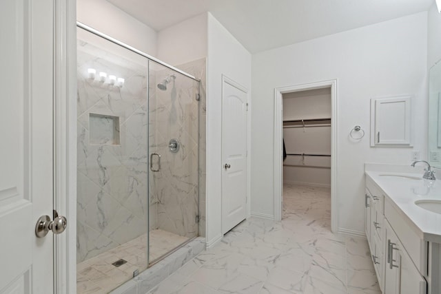 1309 Haybale Ln, Garland, TX 75042 - full bath featuring a marble finish shower, marble look tile flooring, baseboards, and a walk in closet