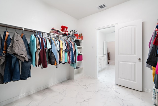 1309 Haybale Ln, Garland, TX 75042 - walk in closet featuring marble finish floors
