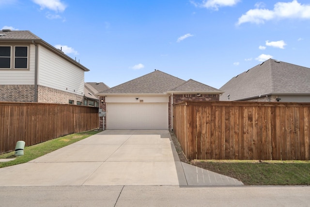 1309 Haybale Ln, Garland, TX 75042 - view of side of property with brick siding, a garage, fence, driveway, and roof with shingles
