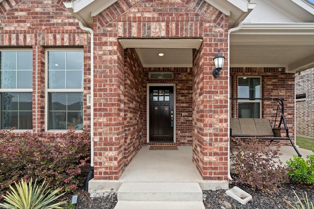 1309 Haybale Ln, Garland, TX 75042 - entrance to property featuring covered porch and brick siding