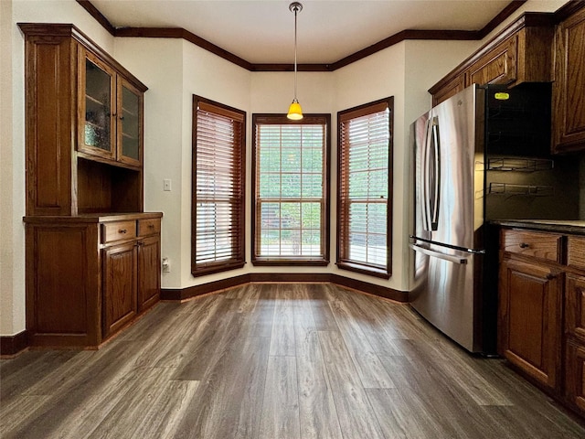 118 Hacienda Dr, Pottsboro, TX 75076 - unfurnished dining area with dark wood finished floors, healthy amount of natural light, ornamental molding, and baseboards